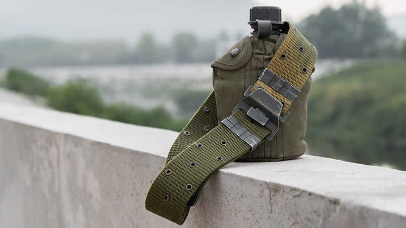 Water Canteen Connected to Tactical Belt Strap